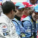 SHANGHAI, CHINA - OCTOBER 16:  Fernando Alonso of Spain and Renault shares a joke with Juan Pablo