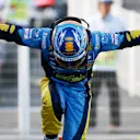 SUZUKA, JAPAN - OCTOBER 08:  Fernando Alonso of Spain and Renault celebrates his victory during the