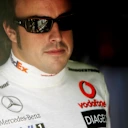 ISTANBUL, TURKEY - AUGUST 25:  Fernando Alonso of Spain and McLaren Mercedes looks on in the pits