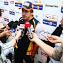 MELBOURNE, AUSTRALIA - MARCH 26:  Fernando Alonso of Spain and Renault is seen talking to the media