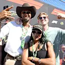 Olympic silver medalist Leo Neugebauer (left), Olympic gold medalist Tara Davis-Woodhall and Paralympic gold medalist Hunter Woodhall on the grid