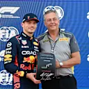 SUZUKA, JAPAN - SEPTEMBER 23: Pole man Max Verstappen, Red Bull Racing, receives his Pirelli Pole Position Award from Mario Isola, Racing Manager, Pirelli Motorsport during the Japanese GP at Suzuka on Saturday September 23, 2023 in Suzuka, Japan. (Photo by Mark Sutton / LAT Images)