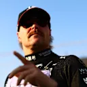 ABU DHABI, UNITED ARAB EMIRATES - NOVEMBER 26: Valtteri Bottas of Finland and Alfa Romeo F1 prepares to drive on the grid prior to the F1 Grand Prix of Abu Dhabi at Yas Marina Circuit on November 26, 2023 in Abu Dhabi, United Arab Emirates. (Photo by Clive Rose/Getty Images)