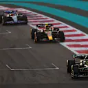 ABU DHABI, UNITED ARAB EMIRATES - NOVEMBER 26: Lewis Hamilton of Great Britain driving the (44) Mercedes AMG Petronas F1 Team W14 leads Sergio Perez of Mexico driving the (11) Oracle Red Bull Racing RB18 during the F1 Grand Prix of Abu Dhabi at Yas Marina Circuit on November 26, 2023 in Abu Dhabi, United Arab Emirates. (Photo by Dan Istitene - Formula 1/Formula 1 via Getty Images)