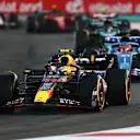 ABU DHABI, UNITED ARAB EMIRATES - NOVEMBER 26: Sergio Perez of Mexico driving the (11) Oracle Red Bull Racing RB18 on track during the F1 Grand Prix of Abu Dhabi at Yas Marina Circuit on November 26, 2023 in Abu Dhabi, United Arab Emirates. (Photo by Clive Rose/Getty Images)