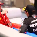 ABU DHABI, UNITED ARAB EMIRATES - NOVEMBER 26: Second placed Charles Leclerc of Monaco and Ferrari talks to Third placed George Russell of Great Britain and Mercedes in the cool down room during the F1 Grand Prix of Abu Dhabi at Yas Marina Circuit on November 26, 2023 in Abu Dhabi, United Arab Emirates. (Photo by Dan Istitene - Formula 1/Formula 1 via Getty Images)