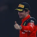 ABU DHABI, UNITED ARAB EMIRATES - NOVEMBER 26: Second placed Charles Leclerc of Monaco and Ferrari celebrates on the podium during the F1 Grand Prix of Abu Dhabi at Yas Marina Circuit on November 26, 2023 in Abu Dhabi, United Arab Emirates. (Photo by Joe Portlock - Formula 1/Formula 1 via Getty Images)