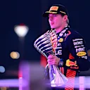 ABU DHABI, UNITED ARAB EMIRATES - NOVEMBER 26: Race winner Max Verstappen of the Netherlands and Oracle Red Bull Racing celebrates on the podium during the F1 Grand Prix of Abu Dhabi at Yas Marina Circuit on November 26, 2023 in Abu Dhabi, United Arab Emirates. (Photo by Mario Renzi - Formula 1/Formula 1 via Getty Images)