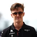 ABU DHABI, UNITED ARAB EMIRATES - NOVEMBER 24: Theo Pourchaire of France and Alfa Romeo F1 walks in the Paddock prior to practice ahead of the F1 Grand Prix of Abu Dhabi at Yas Marina Circuit on November 24, 2023 in Abu Dhabi, United Arab Emirates. (Photo by Clive Rose/Getty Images)