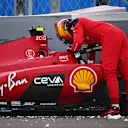 ABU DHABI, UNITED ARAB EMIRATES - NOVEMBER 24: Carlos Sainz of Spain and Ferrari walks from his car after crashing during practice ahead of the F1 Grand Prix of Abu Dhabi at Yas Marina Circuit on November 24, 2023 in Abu Dhabi, United Arab Emirates. (Photo by Clive Mason - Formula 1/Formula 1 via Getty Images)