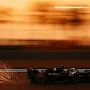 ABU DHABI, UNITED ARAB EMIRATES - NOVEMBER 24: Sparks fly behind Valtteri Bottas of Finland driving the (77) Alfa Romeo F1 C43 Ferrari during practice ahead of the F1 Grand Prix of Abu Dhabi at Yas Marina Circuit on November 24, 2023 in Abu Dhabi, United Arab Emirates. (Photo by Clive Mason - Formula 1/Formula 1 via Getty Images)