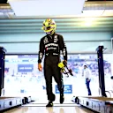 ABU DHABI, UNITED ARAB EMIRATES - NOVEMBER 25: 11th placed qualifier Lewis Hamilton of Great Britain and Mercedes walks in the FIA garage during qualifying ahead of the F1 Grand Prix of Abu Dhabi at Yas Marina Circuit on November 25, 2023 in Abu Dhabi, United Arab Emirates. (Photo by Dan Istitene - Formula 1/Formula 1 via Getty Images)