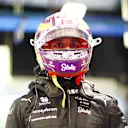 ABU DHABI, UNITED ARAB EMIRATES - NOVEMBER 25: 19th placed qualifier Zhou Guanyu of China and Alfa Romeo F1 looks on in the FIA garage during qualifying ahead of the F1 Grand Prix of Abu Dhabi at Yas Marina Circuit on November 25, 2023 in Abu Dhabi, United Arab Emirates. (Photo by Dan Istitene - Formula 1/Formula 1 via Getty Images)