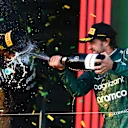 MELBOURNE, AUSTRALIA - APRIL 02: Third placed Fernando Alonso of Spain and Aston Martin F1 Team celebrates on the podium during the F1 Grand Prix of Australia at Albert Park Grand Prix Circuit on April 02, 2023 in Melbourne, Australia. (Photo by Quinn Rooney/Getty Images)