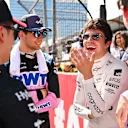 BAKU, AZERBAIJAN - APRIL 30: Lance Stroll of Canada and Aston Martin F1 Team, Logan Sargeant of United States and Williams, Zhou Guanyu of China and Alfa Romeo F1 and Esteban Ocon of France and Alpine F1 talk on the grid prior to the F1 Grand Prix of Azerbaijan at Baku City Circuit on April 30, 2023 in Baku, Azerbaijan. (Photo by Dan Mullan - Formula 1/Formula 1 via Getty Images)