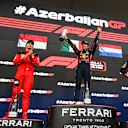 BAKU, AZERBAIJAN - APRIL 30: Race winner Sergio Perez of Mexico and Oracle Red Bull Racing, Third placed Charles Leclerc of Monaco and Ferrari, Second placed Max Verstappen of the Netherlands and Oracle Red Bull Racing and Paul Everington, Head of Electronics at Red Bull Racing celebrate on the podium during the F1 Grand Prix of Azerbaijan at Baku City Circuit on April 30, 2023 in Baku, Azerbaijan. (Photo by Dan Mullan - Formula 1/Formula 1 via Getty Images)