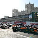 BAKU, AZERBAIJAN - APRIL 29: Oscar Piastri of Australia driving the (81) McLaren MCL60 Mercedes leads Kevin Magnussen of Denmark driving the (20) Haas F1 VF-23 Ferrari at the start during the Sprint ahead of the F1 Grand Prix of Azerbaijan at Baku City Circuit on April 29, 2023 in Baku, Azerbaijan. (Photo by Dan Mullan - Formula 1/Formula 1 via Getty Images)