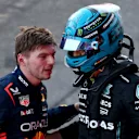 BAKU, AZERBAIJAN - APRIL 29: Third placed Max Verstappen of the Netherlands and Oracle Red Bull Racing and 4th placed George Russell of Great Britain and Mercedes talk in parc ferme during the Sprint ahead of the F1 Grand Prix of Azerbaijan at Baku City Circuit on April 29, 2023 in Baku, Azerbaijan. (Photo by Bryn Lennon - Formula 1/Formula 1 via Getty Images)