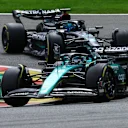 SPA, BELGIUM - JULY 30: Lance Stroll of Canada driving the (18) Aston Martin AMR23 Mercedes George Russell of Great Britain driving the (63) Mercedes AMG Petronas F1 Team W14 on track during the F1 Grand Prix of Belgium at Circuit de Spa-Francorchamps on July 30, 2023 in Spa, Belgium. (Photo by Mark Thompson/Getty Images)
