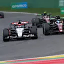 SPA, BELGIUM - JULY 30: Daniel Ricciardo of Australia driving the (3) Scuderia AlphaTauri AT04 leads Valtteri Bottas of Finland driving the (77) Alfa Romeo F1 C43 Ferrari during the F1 Grand Prix of Belgium at Circuit de Spa-Francorchamps on July 30, 2023 in Spa, Belgium. (Photo by Peter Fox/Getty Images)