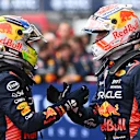 SPA, BELGIUM - JULY 30: Race winner Max Verstappen of the Netherlands and Oracle Red Bull Racing and Second placed Sergio Perez of Mexico and Oracle Red Bull Racing talk in parc ferme during the F1 Grand Prix of Belgium at Circuit de Spa-Francorchamps on July 30, 2023 in Spa, Belgium. (Photo by Dan Mullan/Getty Images)