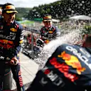 SPA, BELGIUM - JULY 30: Race winner Max Verstappen of the Netherlands and Oracle Red Bull Racing, Second placed Sergio Perez of Mexico and Oracle Red Bull Racing and Greg Reeson, Tyre Technician at Red Bull Racing celebrate on the podium during the F1 Grand Prix of Belgium at Circuit de Spa-Francorchamps on July 30, 2023 in Spa, Belgium. (Photo by Dan Istitene - Formula 1/Formula 1 via Getty Images)