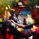 SPA, BELGIUM - JULY 30: Race winner Max Verstappen of the Netherlands and Oracle Red Bull Racing celebrates on the podium with team-mate Sergio Perez of Mexico and Oracle Red Bull Racing during the F1 Grand Prix of Belgium at Circuit de Spa-Francorchamps on July 30, 2023 in Spa, Belgium. (Photo by Dan Istitene - Formula 1/Formula 1 via Getty Images)