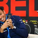 SPA, BELGIUM - JULY 27: Alexander Albon of Thailand and Williams takes a photo of Tom Clarkson wearing his hat in the Drivers Press Conference during previews ahead of the F1 Grand Prix of Belgium at Circuit de Spa-Francorchamps on July 27, 2023 in Spa, Belgium. (Photo by Dan Mullan/Getty Images)