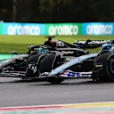 SPA, BELGIUM - JULY 29: George Russell of Great Britain driving the (63) Mercedes AMG Petronas F1 Team W14 and Esteban Ocon of France driving the (31) Alpine F1 A523 Renault battle for track position during the Sprint ahead of the F1 Grand Prix of Belgium at Circuit de Spa-Francorchamps on July 29, 2023 in Spa, Belgium. (Photo by Peter Fox/Getty Images)