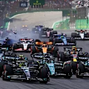 SAO PAULO, BRAZIL - NOVEMBER 05: Lewis Hamilton of Great Britain driving the (44) Mercedes AMG Petronas F1 Team W14, Lance Stroll of Canada driving the (18) Aston Martin AMR23 Mercedes and Fernando Alonso of Spain driving the (14) Aston Martin AMR23 Mercedes battle for track position into turn 1 of the F1 Grand Prix of Brazil on November 05, 2023 (Photo by Mark Thompson/Getty Images)