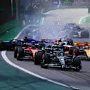 SAO PAULO, BRAZIL - NOVEMBER 05: Alexander Albon of Thailand driving the (23) Williams FW45 Mercedes and Kevin Magnussen of Denmark driving the (20) Haas F1 VF-23 Ferrari (obscured) crash into turn one at the start during the F1 Grand Prix of Brazil at Autodromo Jose Carlos Pace on November 05, 2023 in Sao Paulo, Brazil. (Photo by Mark Thompson/Getty Images)