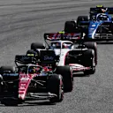 SAO PAULO, BRAZIL - NOVEMBER 05: Zhou Guanyu of China driving the (24) Alfa Romeo F1 C43 Ferrari leads Nico Hulkenberg of Germany driving the (27) Haas F1 VF-23 Ferrari and Logan Sargeant of United States driving the (2) Williams FW45 Mercedes  during the F1 Grand Prix of Brazil at Autodromo Jose Carlos Pace on November 05, 2023 in Sao Paulo, Brazil. (Photo by Rudy Carezzevoli/Getty Images)
