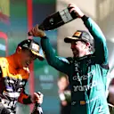 SAO PAULO, BRAZIL - NOVEMBER 05: Second placed Lando Norris of Great Britain and McLaren and Third placed Fernando Alonso of Spain and Aston Martin F1 Team celebrate on the podium during the F1 Grand Prix of Brazil at Autodromo Jose Carlos Pace on November 05, 2023 in Sao Paulo, Brazil. (Photo by Dan Istitene - Formula 1/Formula 1 via Getty Images)