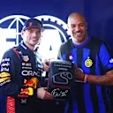 SAO PAULO, BRAZIL - NOVEMBER 03: Pole position qualifier Max Verstappen of the Netherlands and Oracle Red Bull Racing is presented with the Pirelli Pole Position award by Adriano after qualifying ahead of the F1 Grand Prix of Brazil at Autodromo Jose Carlos Pace on November 03, 2023 in Sao Paulo, Brazil. (Photo by Dan Istitene - Formula 1/Formula 1 via Getty Images)