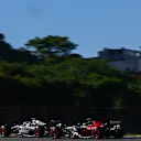 SAO PAULO, BRAZIL - NOVEMBER 04: Nico Hulkenberg of Germany driving the (27) Haas F1 VF-23 Ferrari leads Zhou Guanyu of China driving the (24) Alfa Romeo F1 C43 Ferrari on track during the Sprint ahead of the F1 Grand Prix of Brazil at Autodromo Jose Carlos Pace on November 04, 2023 in Sao Paulo, Brazil. (Photo by Clive Mason - Formula 1/Formula 1 via Getty Images)