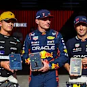 SAO PAULO, BRAZIL - NOVEMBER 04: Sprint winner Max Verstappen of the Netherlands and Oracle Red Bull Racing (C), Second placed Lando Norris of Great Britain and McLaren and Third placed Sergio Perez of Mexico and Oracle Red Bull Racing celebrate in parc ferme during the Sprint ahead of the F1 Grand Prix of Brazil at Autodromo Jose Carlos Pace on November 04, 2023 in Sao Paulo, Brazil. (Photo by Mark Thompson/Getty Images)