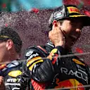 BUDAPEST, HUNGARY - JULY 23: Race winner Max Verstappen of the Netherlands and Oracle Red Bull Racing and Third placed Sergio Perez of Mexico and Oracle Red Bull Racing celebrate on the podium during the F1 Grand Prix of Hungary at Hungaroring on July 23, 2023 in Budapest, Hungary. (Photo by Dan Istitene - Formula 1/Formula 1 via Getty Images)