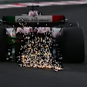 BUDAPEST, HUNGARY - JULY 21: Sparks fly behind Valtteri Bottas of Finland driving the (77) Alfa Romeo F1 C43 Ferrari during practice ahead of the F1 Grand Prix of Hungary at Hungaroring on July 21, 2023 in Budapest, Hungary. (Photo by Dan Mullan/Getty Images)