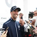 BUDAPEST, HUNGARY - JULY 21: Daniel Ricciardo of Australia and Scuderia AlphaTauri talks to the media in the Paddock after practice ahead of the F1 Grand Prix of Hungary at Hungaroring on July 21, 2023 in Budapest, Hungary. (Photo by Peter Fox/Getty Images)