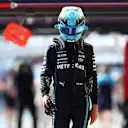 BUDAPEST, HUNGARY - JULY 22: 18th placed qualifier George Russell of Great Britain and Mercedes walks in the Pitlane during qualifying ahead of the F1 Grand Prix of Hungary at Hungaroring on July 22, 2023 in Budapest, Hungary. (Photo by Dan Istitene - Formula 1/Formula 1 via Getty Images)