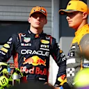 BUDAPEST, HUNGARY - JULY 22: Second placed qualifier Max Verstappen of the Netherlands and Oracle Red Bull Racing talks with Third placed qualifier Lando Norris of Great Britain and McLaren in parc ferme during qualifying ahead of the F1 Grand Prix of Hungary at Hungaroring on July 22, 2023 in Budapest, Hungary. (Photo by Dan Istitene - Formula 1/Formula 1 via Getty Images)