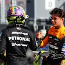BUDAPEST, HUNGARY - JULY 22: Pole position qualifier Lewis Hamilton of Great Britain and Mercedes and Third placed qualifier Lando Norris of Great Britain and McLaren talk in parc ferme during qualifying ahead of the F1 Grand Prix of Hungary at Hungaroring on July 22, 2023 in Budapest, Hungary. (Photo by Mark Thompson/Getty Images)