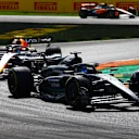 MONZA, ITALY - SEPTEMBER 03: George Russell of Great Britain driving the (63) Mercedes AMG Petronas F1 Team W14 leads Sergio Perez of Mexico driving the (11) Oracle Red Bull Racing RB19 during the F1 Grand Prix of Italy at Autodromo Nazionale Monza on September 03, 2023 in Monza, Italy. (Photo by Mark Thompson/Getty Images)