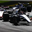 MONZA, ITALY - SEPTEMBER 03: Liam Lawson of New Zealand driving the (40) Scuderia AlphaTauri AT04 leads Nico Hulkenberg of Germany driving the (27) Haas F1 VF-23 Ferrari during the F1 Grand Prix of Italy at Autodromo Nazionale Monza on September 03, 2023 in Monza, Italy. (Photo by Mark Thompson/Getty Images)