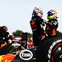MONZA, ITALY - SEPTEMBER 03: Race winner Max Verstappen of the Netherlands and Oracle Red Bull Racing and Second placed Sergio Perez of Mexico and Oracle Red Bull Racing celebrate in parc ferme during the F1 Grand Prix of Italy at Autodromo Nazionale Monza on September 03, 2023 in Monza, Italy. (Photo by Mark Thompson/Getty Images)