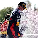 MONZA, ITALY - SEPTEMBER 03: Race winner Max Verstappen of the Netherlands and Oracle Red Bull Racing celebrates on the podium during the F1 Grand Prix of Italy at Autodromo Nazionale Monza on September 03, 2023 in Monza, Italy. (Photo by Dan Istitene - Formula 1/Formula 1 via Getty Images)