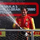 MONZA, ITALY - SEPTEMBER 03: Third placed Carlos Sainz of Spain and Ferrari celebrates on the podium during the F1 Grand Prix of Italy at Autodromo Nazionale Monza on September 03, 2023 in Monza, Italy. (Photo by Ryan Pierse/Getty Images)