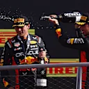 MONZA, ITALY - SEPTEMBER 03: Race winner Max Verstappen of the Netherlands and Oracle Red Bull Racing and Second placed Sergio Perez of Mexico and Oracle Red Bull Racing celebrate on the podium during the F1 Grand Prix of Italy at Autodromo Nazionale Monza on September 03, 2023 in Monza, Italy. (Photo by Ryan Pierse/Getty Images)