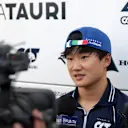 MONZA, ITALY - SEPTEMBER 01: Yuki Tsunoda of Japan and Scuderia AlphaTauri talks to the media in the Paddock after practice ahead of the F1 Grand Prix of Italy at Autodromo Nazionale Monza on September 01, 2023 in Monza, Italy. (Photo by Peter Fox/Getty Images)