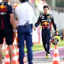 MONZA, ITALY - SEPTEMBER 01: Sergio Perez of Mexico and Oracle Red Bull Racing walks in the Pitlane after crashing during practice ahead of the F1 Grand Prix of Italy at Autodromo Nazionale Monza on September 01, 2023 in Monza, Italy. (Photo by Dan Istitene - Formula 1/Formula 1 via Getty Images)